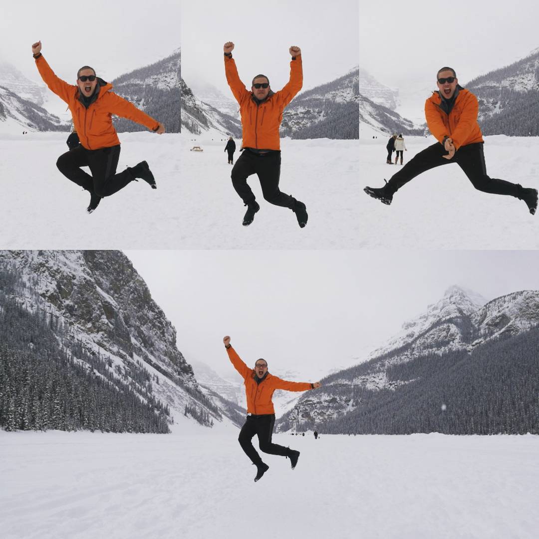 Strange man jumping at the Lake Louise, seems happy